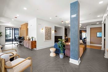 Resident co-working lounge with coffee bar and business center with pcs and wireless printing